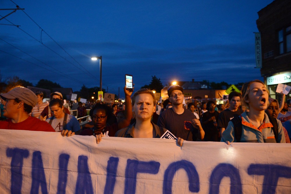 Protestors march on University Avenue in St. Paul on Friday, June 16.