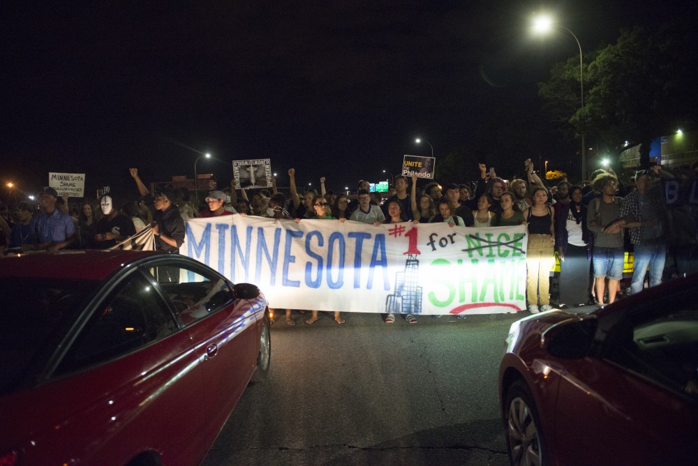 Cars stop for protestors on both sides of I-94 in St. Paul on Friday, June 16.