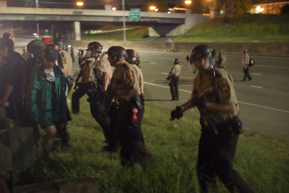 Law enforcement officers move in to contain protestors in St. Paul on Saturday, June 17.