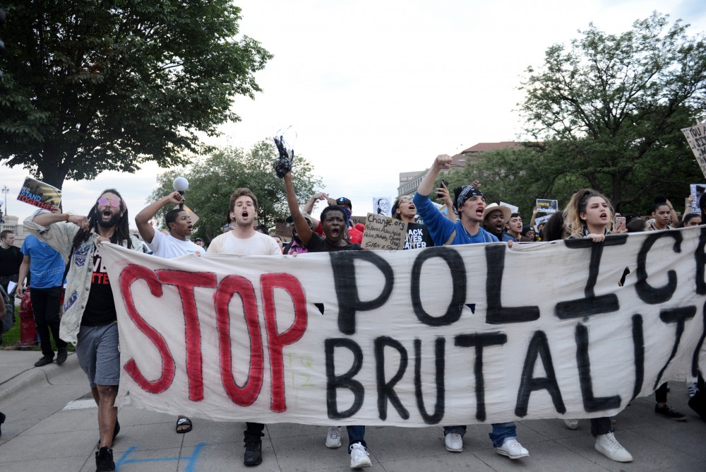Protestors start to march down University Avenue in St.Paul on Friday, June 16.