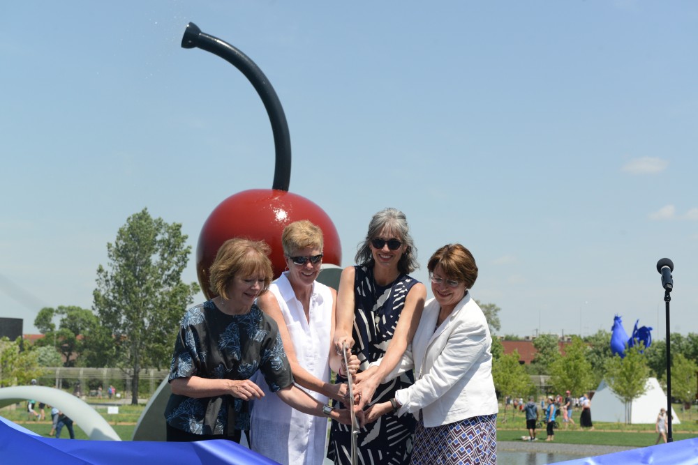 A symbolic cutting of the ribbon by Lt. Gov. Tina Smith, left to right, Minneapolis Parks superintendent Jayne Miller, Walker Art Center executive director Olga Viso and Sen. Amy Klobuchar officially marked the reopening of the Minneapolis Sculpture Garden on Saturday, June 10, 2017. 