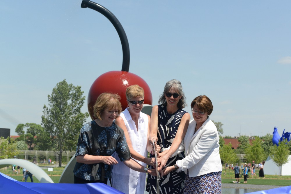 A symbolic cutting of the ribbon by Lt. Gov. Tina Smith, left to right, Minneapolis Parks superintendent Jayne Miller, Walker Art Center executive director Olga Viso and Sen. Amy Klobuchar officially marked the reopening of the Minneapolis Sculpture Garden on Saturday, June 10, 2017.