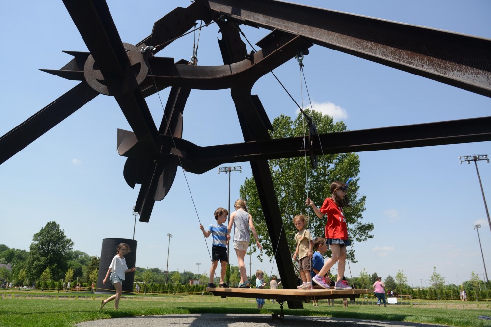 The Minneapolis Sculpture Garden reopened to the public on Saturday, June 10, 2017, drawing Minneapolitans of all ages outside the Walker Art Center to enjoy the public art space.