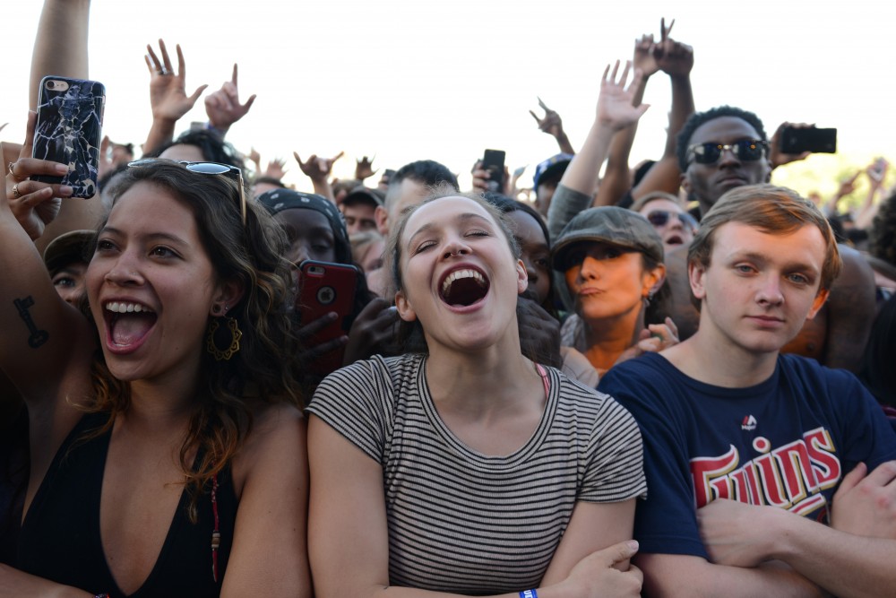 Rosie Griffiths, left, & Jade Balcos shout as Gucci Mane performs at Soundset. 