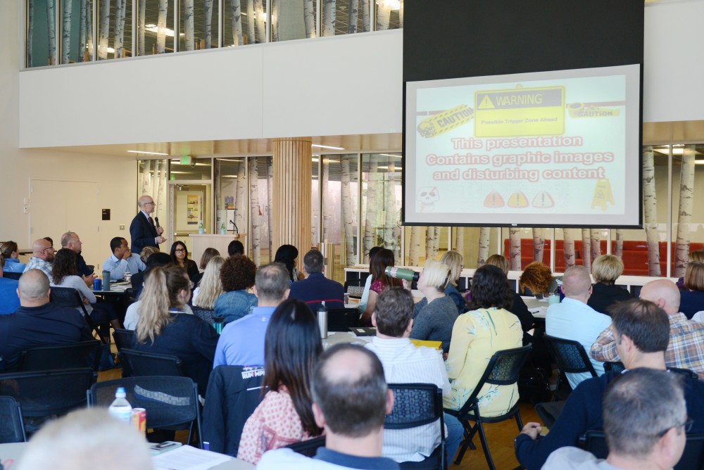 Russell Strand speaks to officers about the best interview strategies for sexual assault survivors at the Recreation and Wellness Center on June 27, on East Bank. 