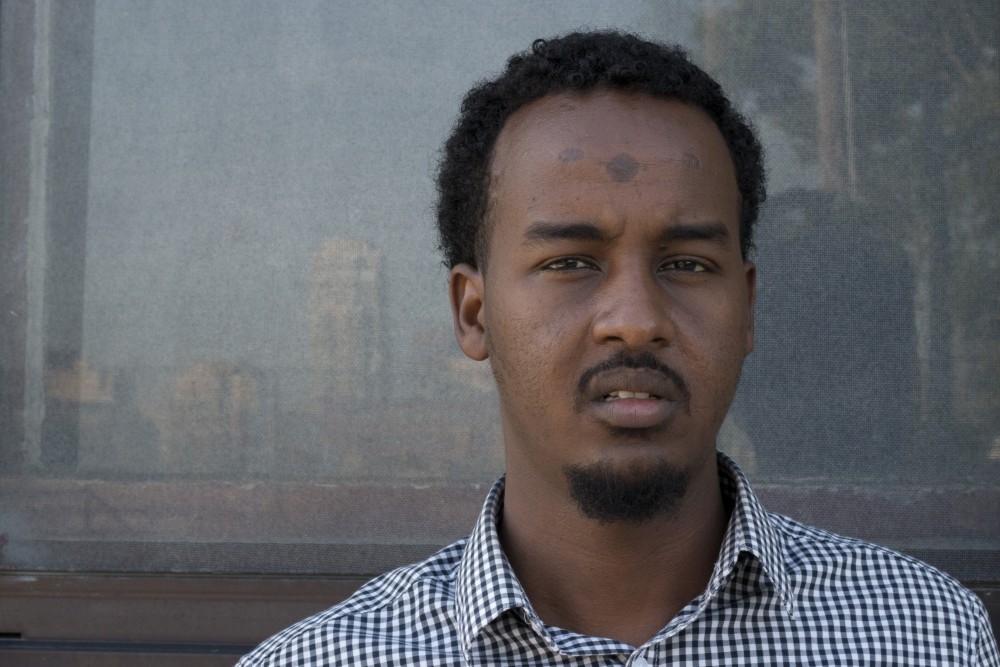 Suud Olat, a contributor to A Stray and former Kenyan refugee, poses for a portrait on Tuesday, July 11, 2017 in the Cedar Riverside neighborhood. The 25-year-old, who is also an interpreter at St. Cloud Hospital, hopes that sharing his story through the film will improve the impression of the Somali community in Minneapolis and elsewhere.