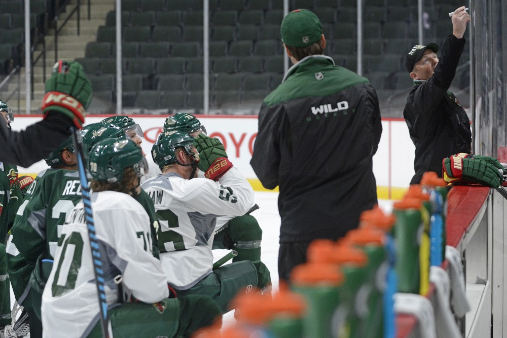 Players huddle and listen on Saturday, July 8 in the Excel Energy Center. The Minnesota Wild Development Camp runs from July 8 to 13.