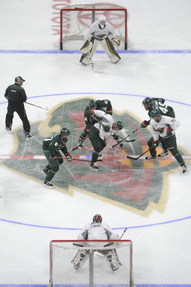 Players skirmish Saturday, July 8 in the Excel Energy Center. The Minnesota Wild Development Camp runs from July 8 to 13.