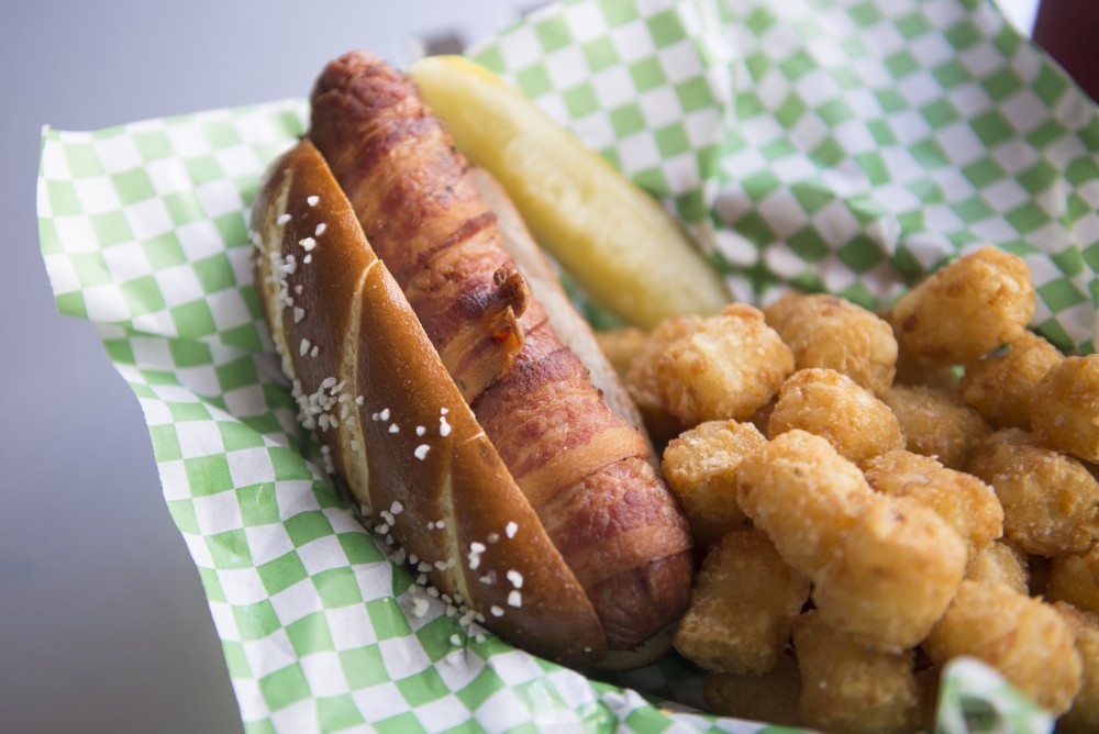 The Diamond Dog available at The Depot Tavern in Minneapolis. The quarter pound dog is an all-beef hot dog wrapped in pepper bacon, deep fried and served on a pretzel bun.