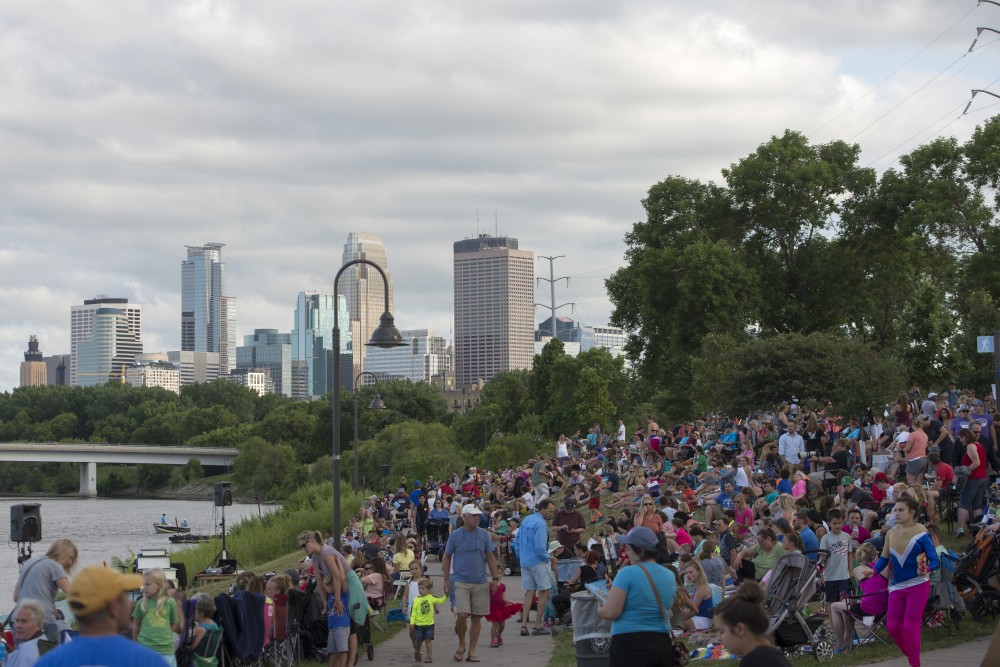 Attendees gather to watch the Twin Cities River Rats Aquatennial Show west of the Mississippi River in Minneapolis on Fri. July, 2017. 