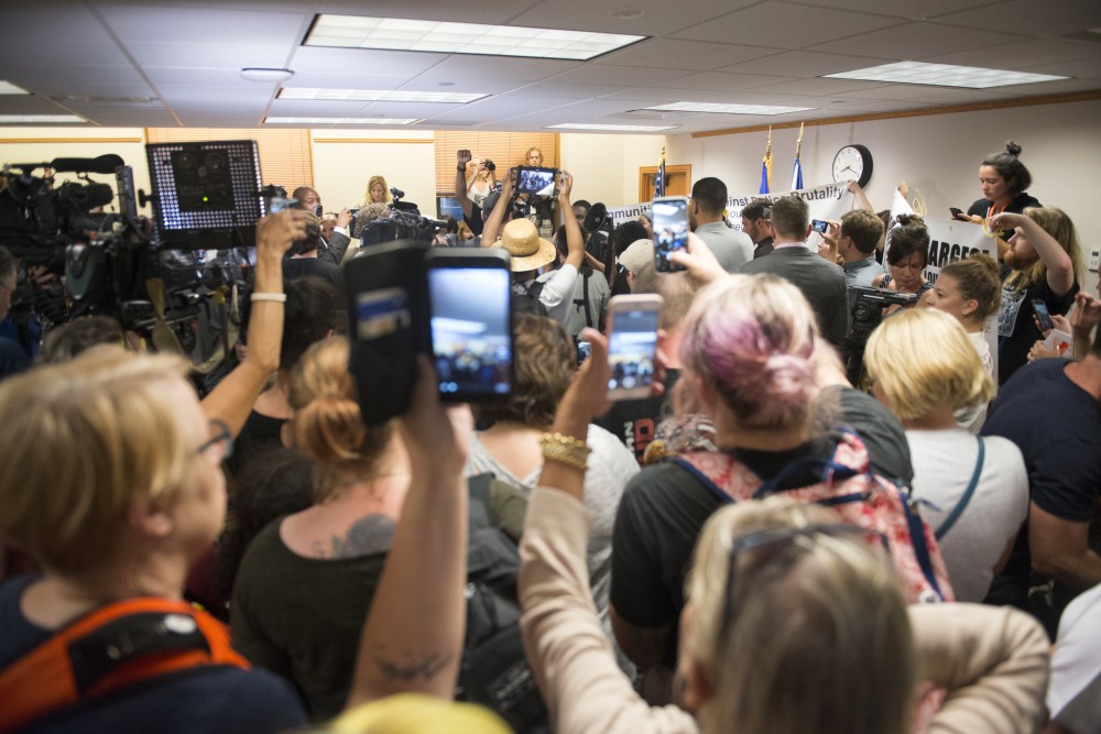 Protesters and media are backed to the walls after news breaks about Police Chief Janee´ Harteaus resignation on Friday at Minneapolis City Hall.