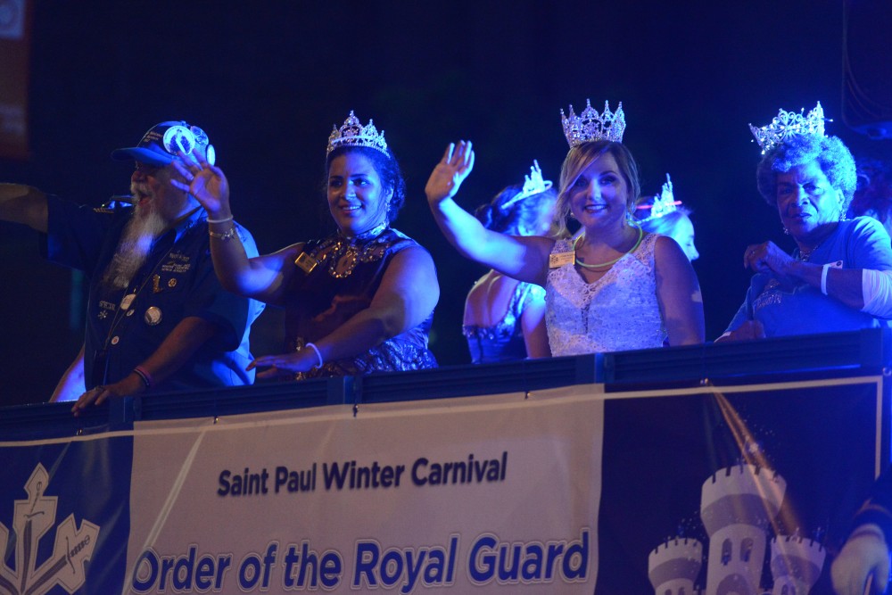 Members of the Saint Paul Winter Carnival Royal Guard participate in the 17th annual CenterPoint Energy Torchlight Parade along Hennepin Avenue on Wednesday.