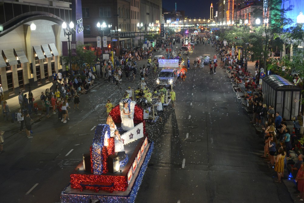 Floats trundle through the 17th annual CenterPoint Energy Torchlight Parade along Hennepin Avenue on Wednesday.