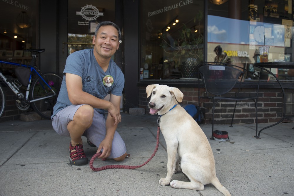 Louie Tran and his new dog Jaspen sit outside Espresso Royale in Dinkytown. Louie Tran is a regular at Espresso Royale with his old beloved dog Chip.