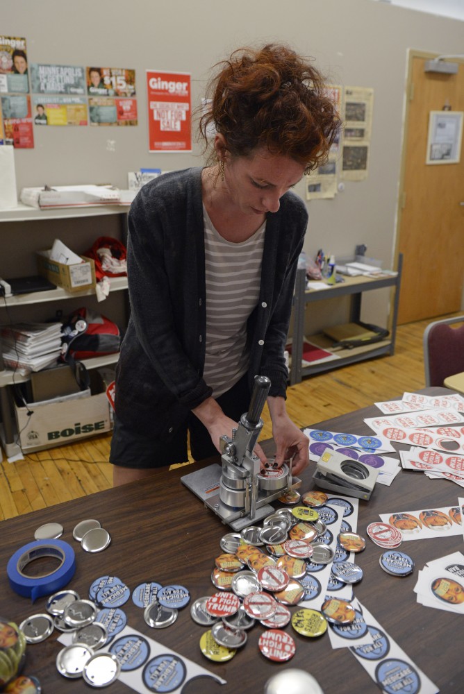 Ginger Jentzen, candidate for the Ward 3 City Council seat, works on campaign buttons in her office in Northeast Minneapolis on Thursday, Aug. 31.