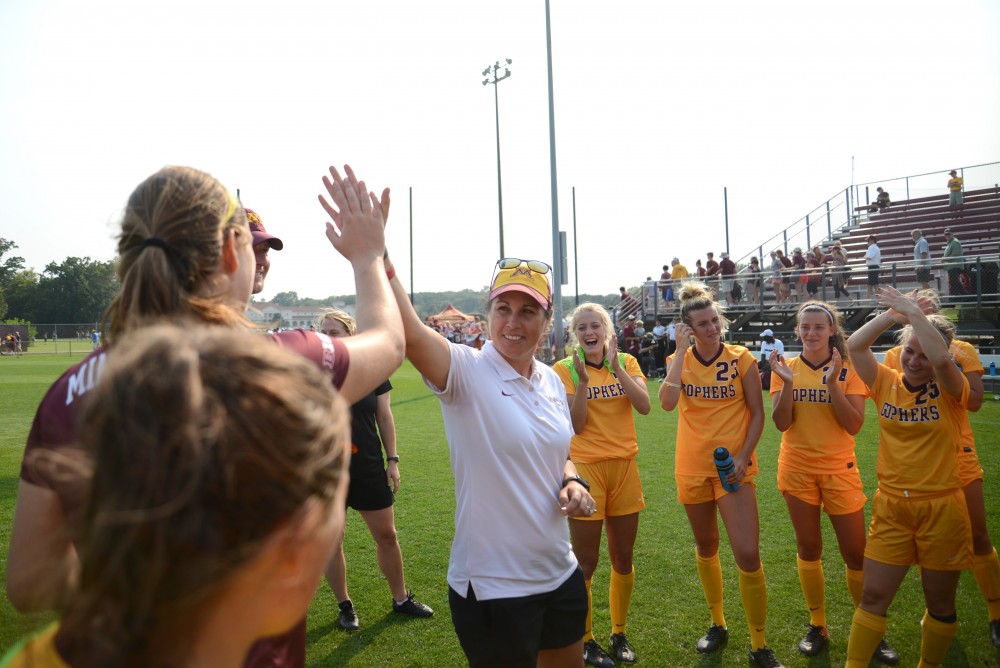 The Gophers soccer team celebrates a 1-0 victory against Providence in overtime on Sept. 3 at Elizabeth Lyle-Robbie Stadium. 