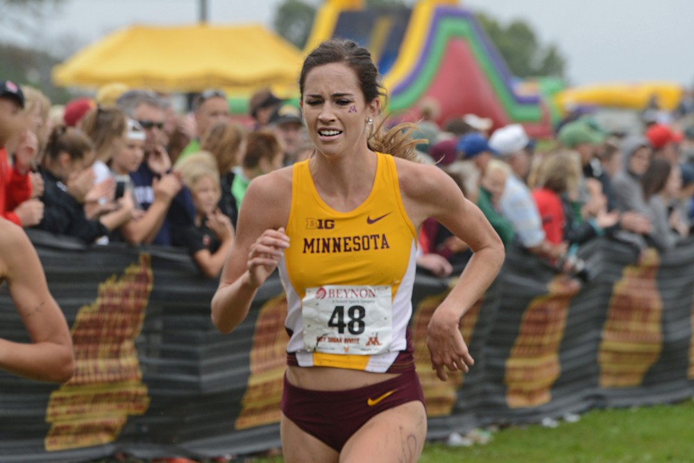 Redshirt junior Madeline Strandemo runs in the Jack Johnson Womens Gold Race at the Roy Griak Invitational on Saturday, Sept. 24, 2016 at the Les Bolstad golf course. 