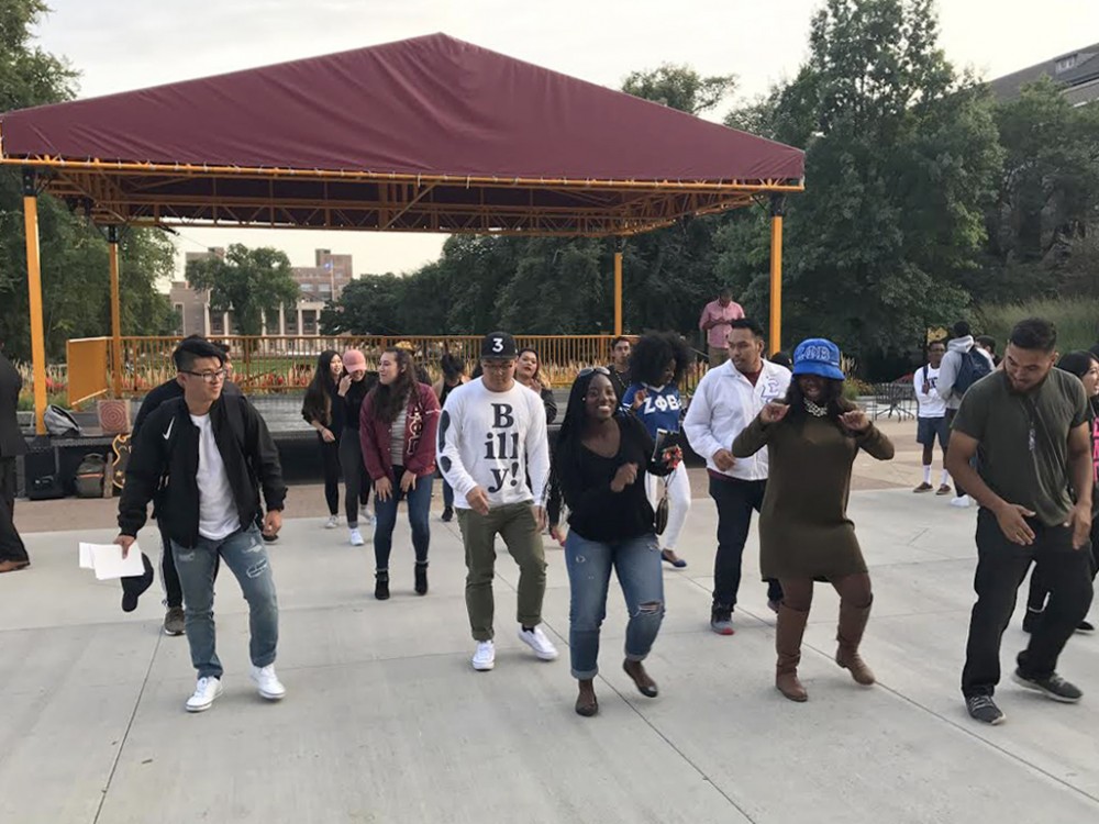 Members of the Multicultural Greek Council and the National Pan-Hellenic Council dance on Northrop Plaza at the Cultural Greek Meet & Greet on Sept. 7.
