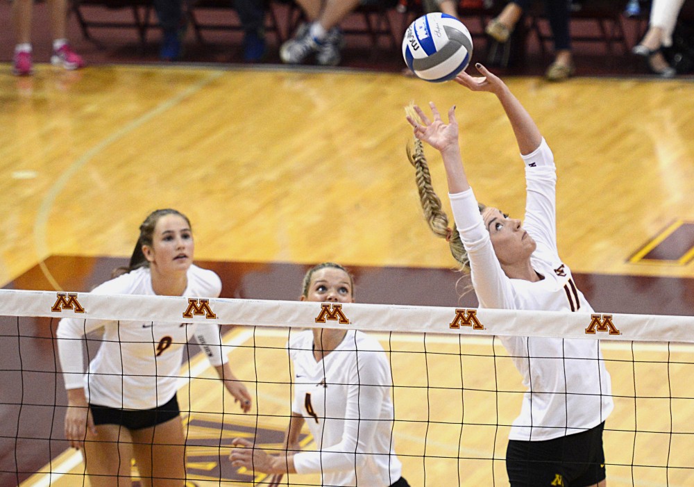 Gophers sophomore Samantha Seliger-Swenson sets the ball on Sept. 23, 2016 in a match against Maryland in the Sports Pavillon. 