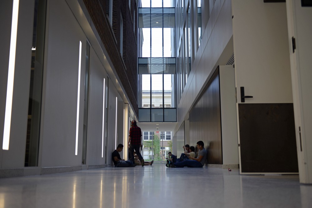 Students wait outside of classrooms in the Tate Laboratory of Physics on East Bank on Monday Sept. 11.