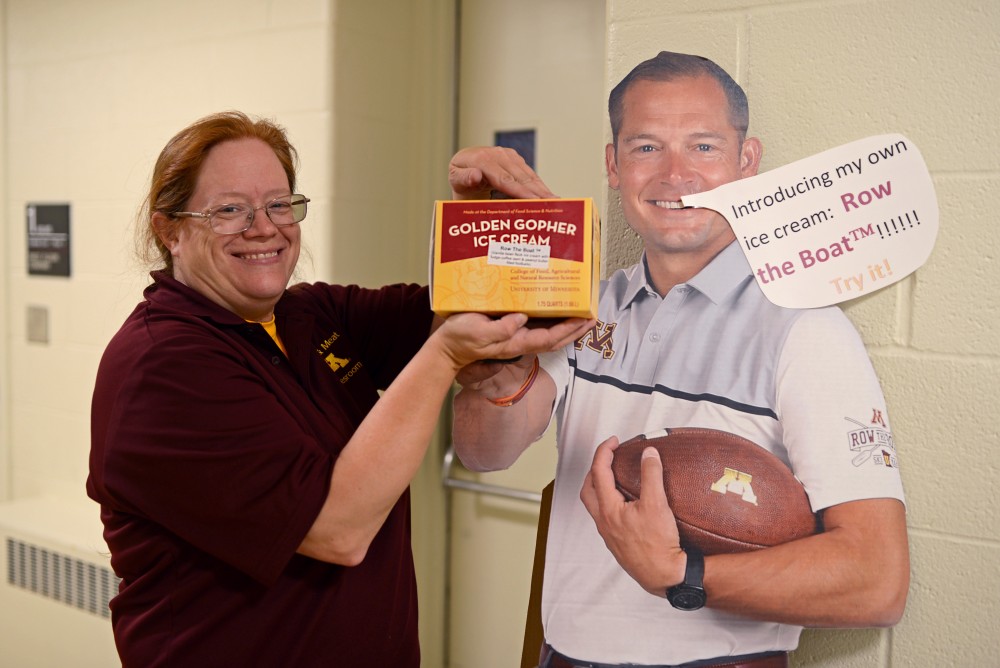 Store manager Jodi Nelson shows off a new ice cream flavor Row The Boat inspired by Gophers head football coach P.J. Fleck on Wednesday, Sept. 6.  