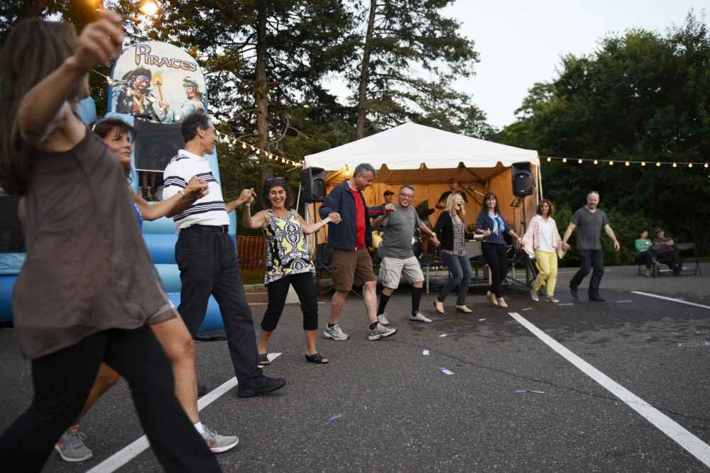 Festival goers dance to music performed by The Levendes at the Minneapolis Greek Festival at St. Marys Greek Orthodox Church on Saturday, Sept. 9.