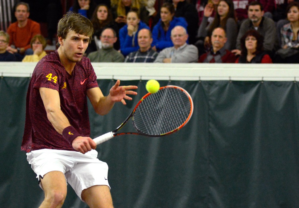 Gophers senior Matic Spec returns the ball to South Florida in the Baseline Tennis Center on Friday, Feb. 5, 2016.
