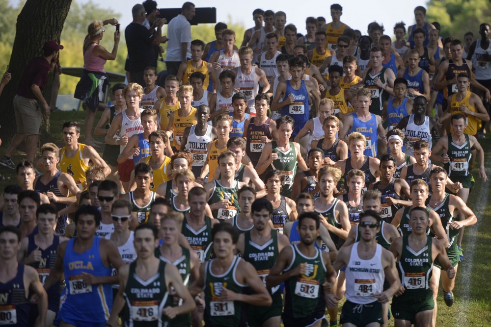 The gopher mens cross country team runs against other Division I teams at the start of the Gold Division 8k during the Roy Griak Invitational at the Les Bolstad Golf Course in St. Paul on Saturday, Sept. 23.