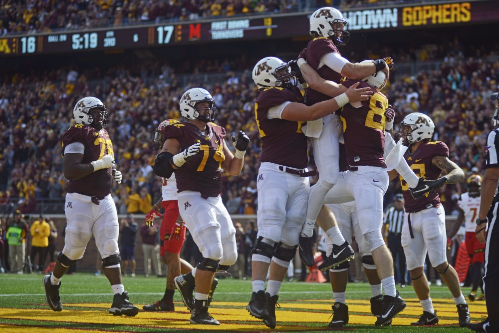 The Gopher football team celebrates a touchdown on Saturday at TCF Bank Stadium.