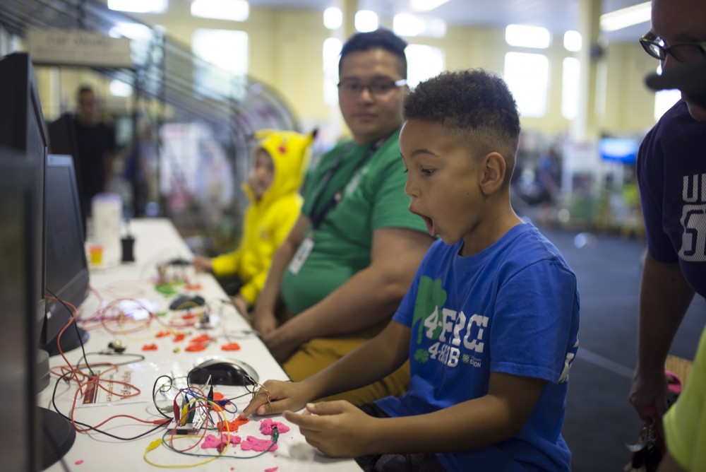 4-H cloverbud Ty Peterson connects circuits with Play-Doh to allow control of a Super Mario online game at the 4-H building at the Minnesota State Fair on Thursday, August 31, 2017.