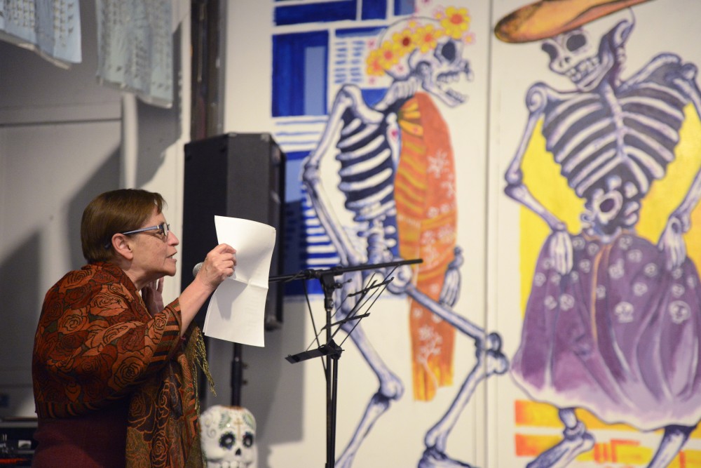 Teresa Ortis reads the poem Espejos / Mirrors during the Festival de Las Calaveras on Thursday, Sept. 28 at Intermedia Arts in Minneapolis. 