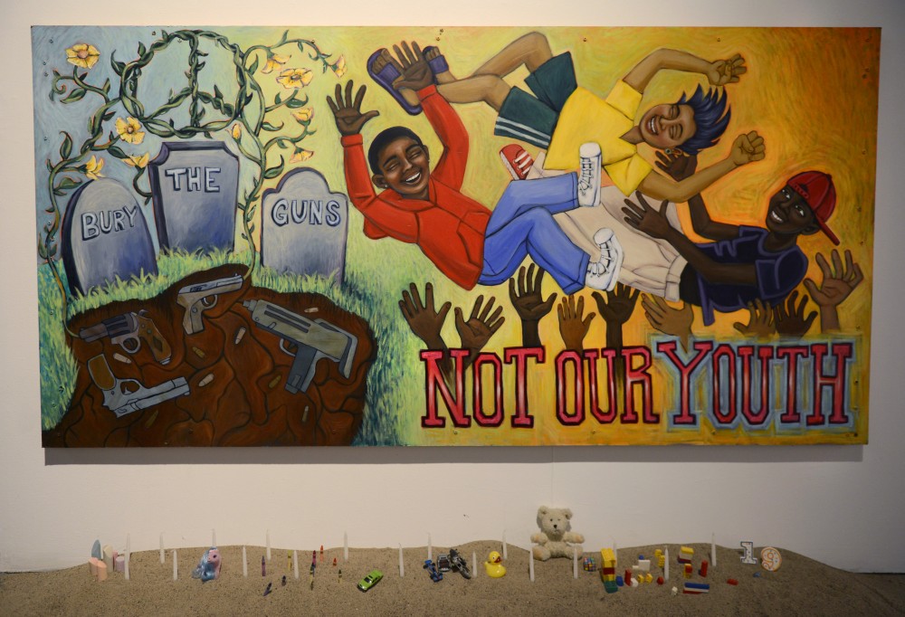 Bury the Guns, Not Our Youth by Melodee Strong hangs on display at Intermedia Arts in Minneapolis on Thursday, Sept. 28.