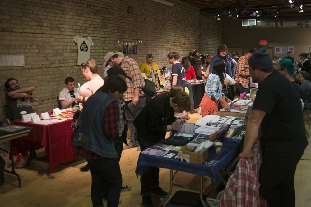 Attendees browse tables at the Minneapolis Zine Fest on Saturday, Sept. 30. 