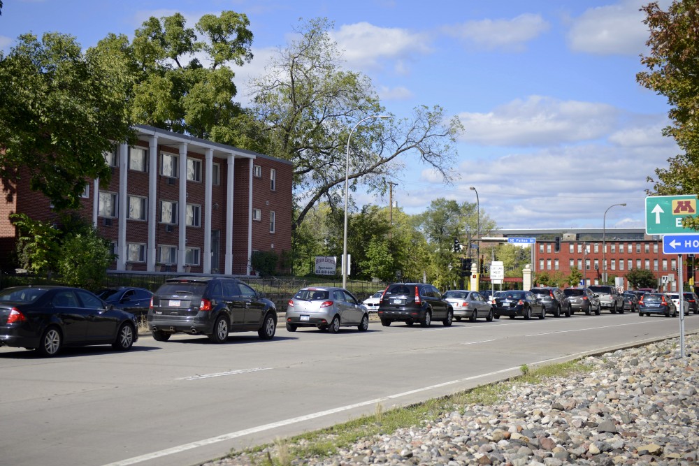 Traffic on Huron Boulevard on Friday, Sept. 29. The University of Minnesota recently purchased the property seen left, with plans to expand one of the main campus thoroughfares.