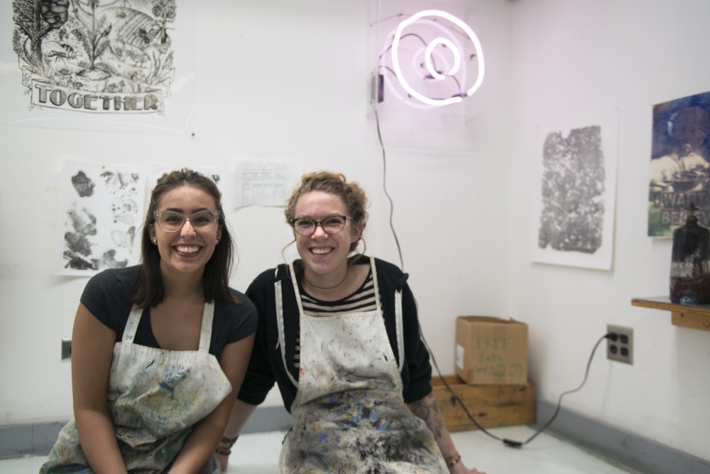 Bohemian Press co-president Olivia Novotny, right, and Maureen Amundson pose for a photo in the print making studio at Regis West on Wednesday, Oct. 4.
