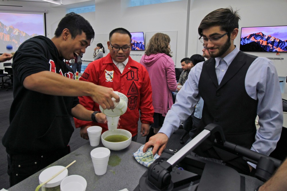 Secretary of the Pi Delta Psi Fraternity, Yengcha Lee, teaches Social Chair of the Pi Delta Psi Fraternity, Zachary Keo, how to make tea at Bruininks Hall on Friday, Oct. 6. This was a tea ceremony event between the Pi Delta Psi Fraternity and the Japanese Student Association.