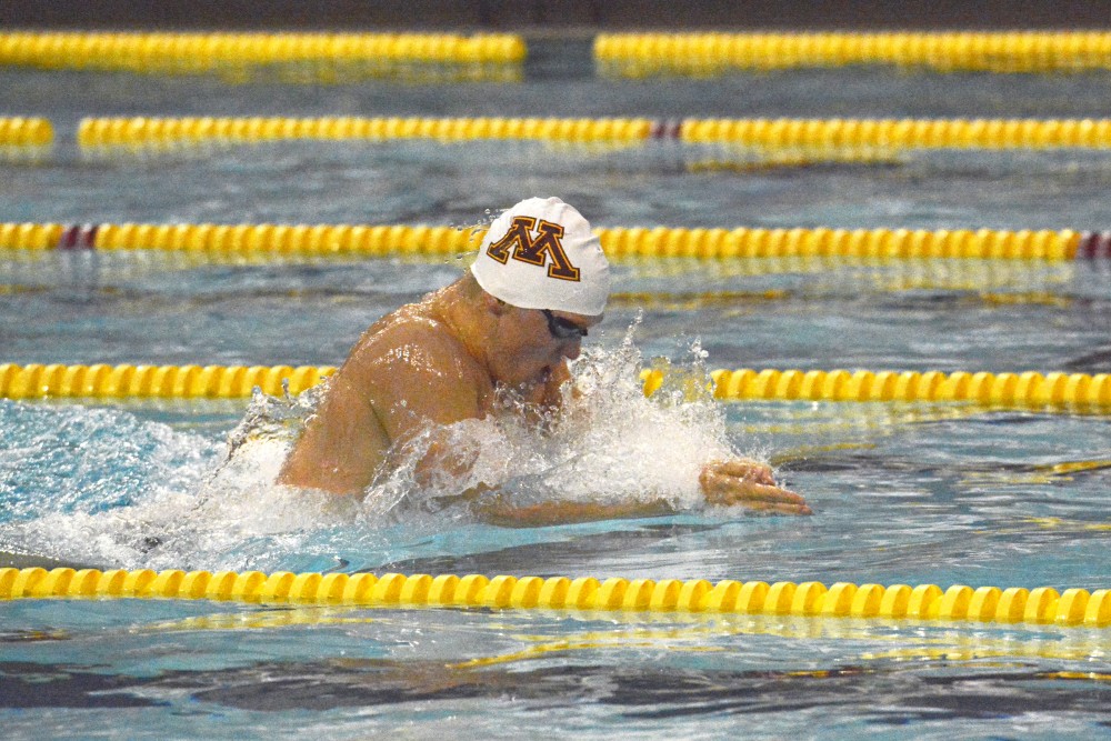 Junior Connor McHugh swimming the mens 200 meter breaststroke at the Gophers first meet of the season against the Wisconsin Badgers at the Jean K. Freeman Aquatics Center on Oct 13. 2016. 