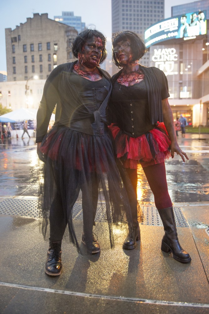 Collette Hermes and Nicole Kendricks wear black swan inspired zombie costumes during the Zombie Pub Crawl on Saturday, Oct. 14 in downtown Minneapolis.