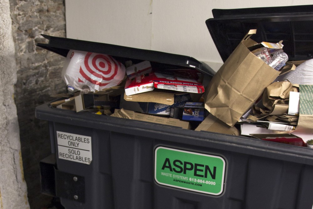 A recycling bin begins to overflow at Northstar Apartments on Sunday, Oct. 15
