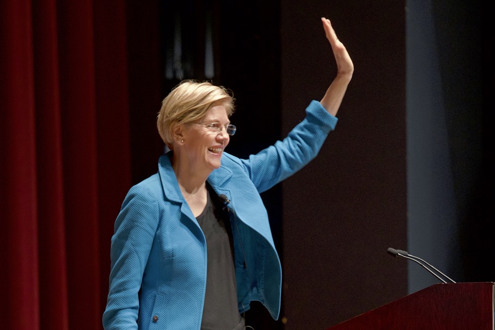 Sen. Elizabeth Warren greets the audience at the Humphrey School of Public Affairs before delivering a speech on Activism, Paul Wellstone and the Politics of Power on Oct. 22.