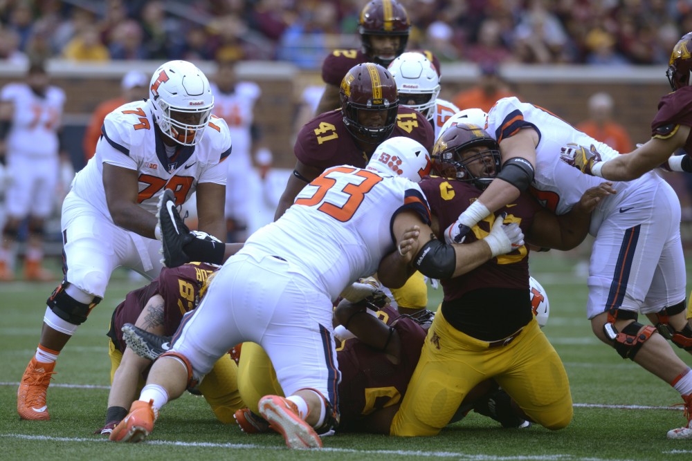 Defensive lineman Steven Richardson is tackled on Saturday, Oct. 21 at TCF Bank Stadium. The Gophers defeated Illinois 24-17 during the homecoming game.