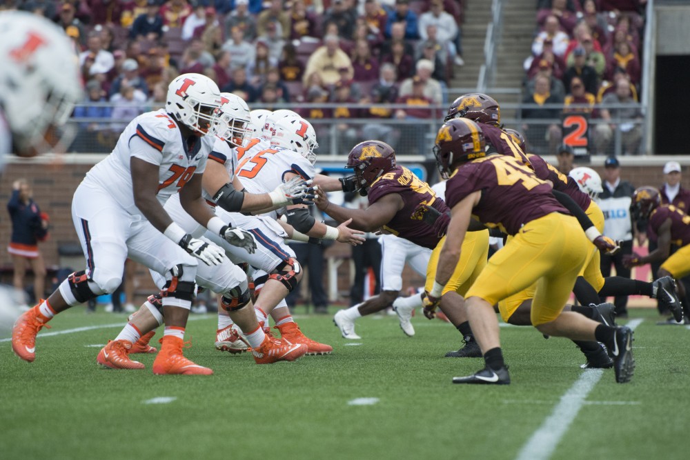 The Gophers defensive line rushes the quarterback at the homecoming game against Illinois at TCF Bank Stadium on Saturday, Oct. 21.