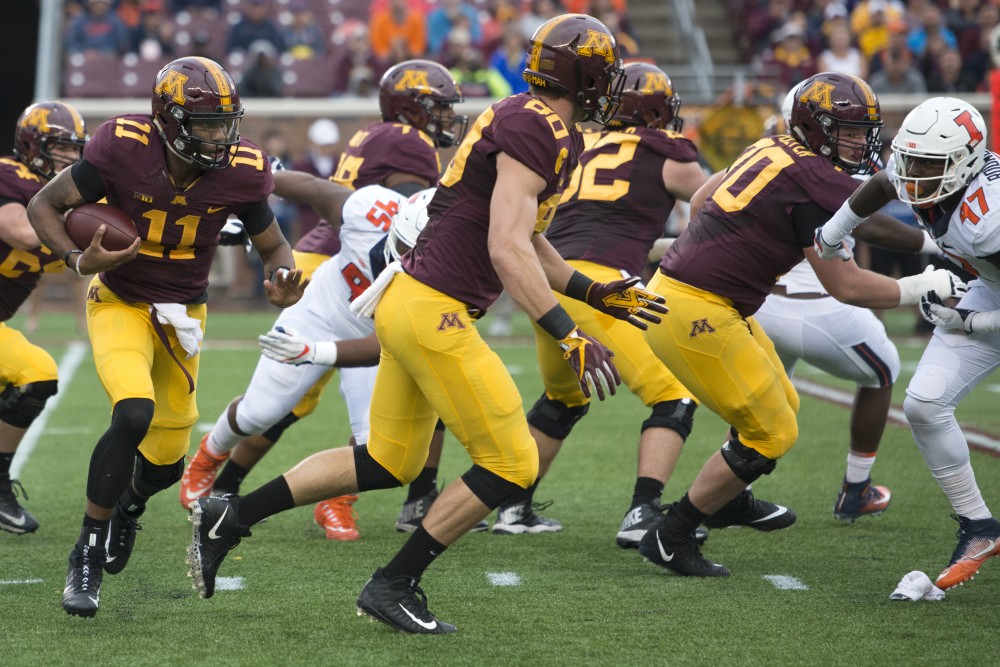 Quarterback Demry Croft rushes the ball at the homecoming game against Illinois at TCF Bank Stadium on Saturday, Oct. 21.