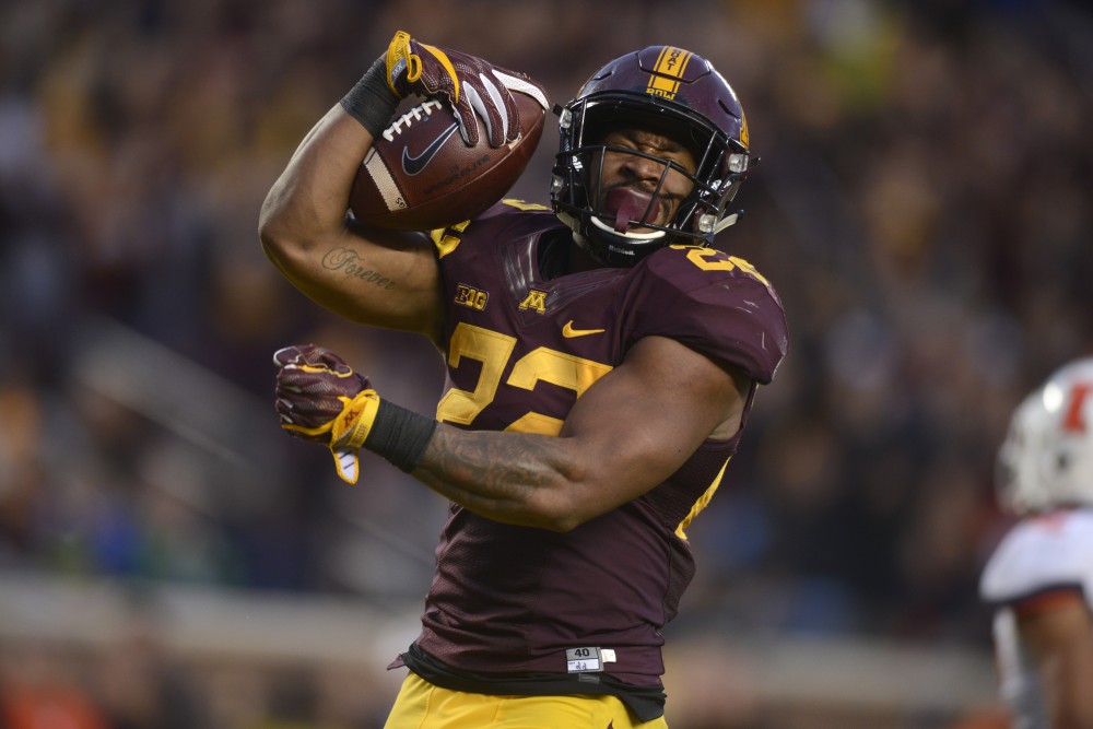 Running back Kobe McCrary celebrates his touchdown at the homecoming game against Illinois at TCF Bank Stadium on Saturday, Oct. 21.