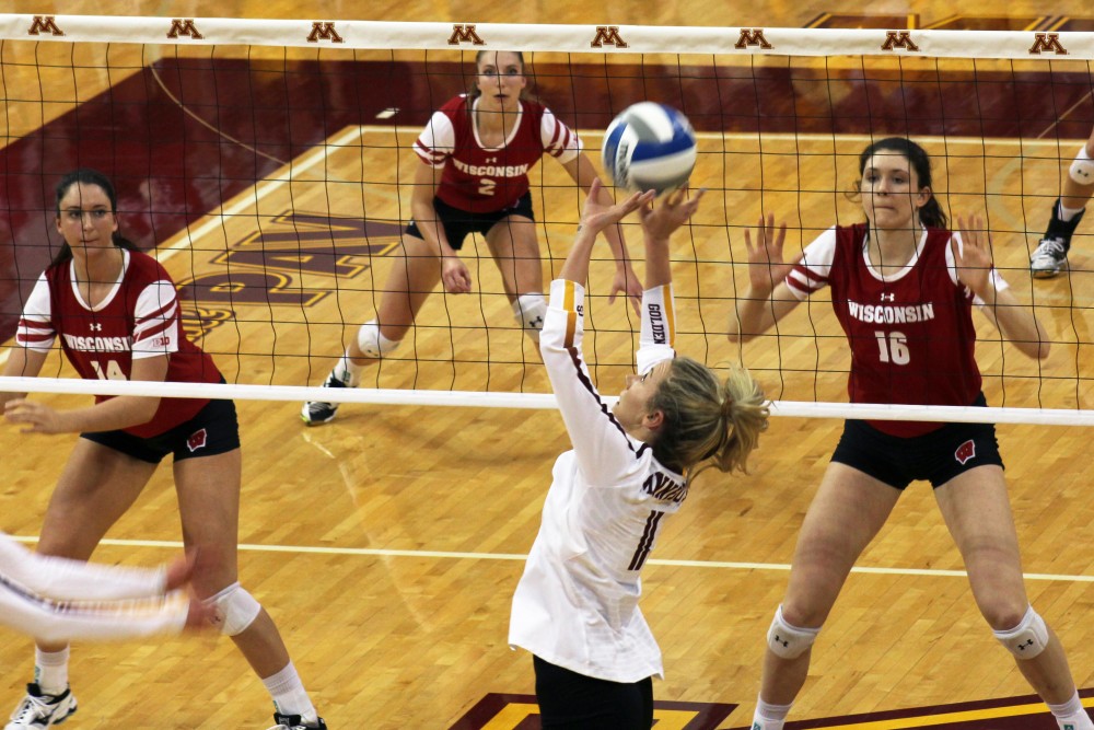 Setter Samantha Seliger-Swenson sets the ball at the Gophers game against the Badgers at the Maturi Pavilion on Saturday, Oct. 21.