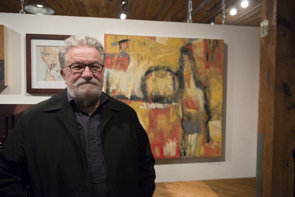 Jack Dale stands in front of his piece complexity during the Northeast Minneapolis Arts Associations member art show at Solar Arts by Chowgirls in northeast Minneapolis on Friday, Oct. 27. Dale is a former University of Minnesota hockey player. 