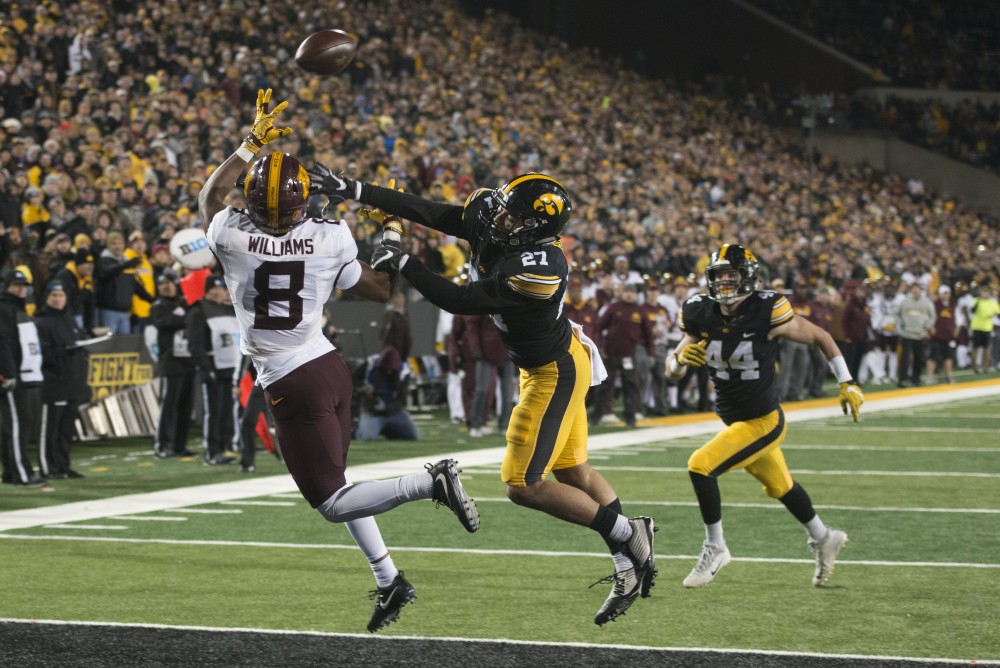 Wide receiver Mark Williams attempts to catch a pass from Quarterback Demry Croft at Kinnick Stadium on Saturday, Oct. 28.
