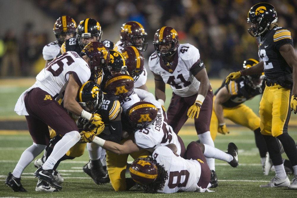 The Gophers tackle running back Akrum Wadley at Kinnick Stadium on Saturday, Oct. 28.