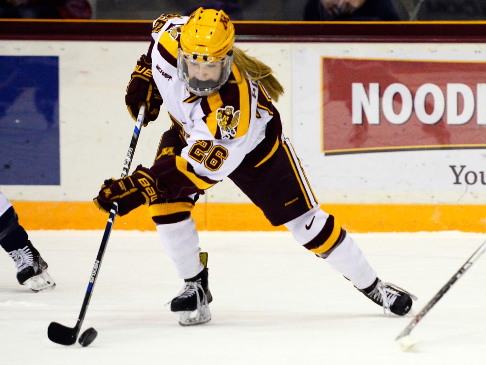 Gophers forward Sarah Potomak maneuvers the puck away from Yale at Ridders Arena on Nov. 20, 2015. 