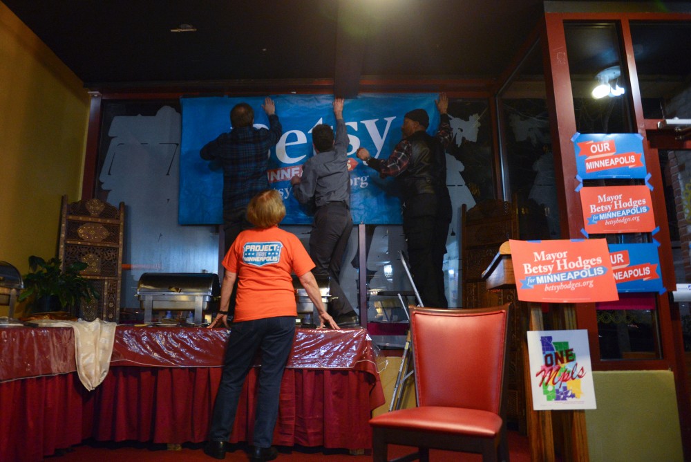 A Betsy for Minneapolis sign is hung in the window of the Gandhi Mahal Restaurant where Betsy Hodges election night party is held on Tuesday, Nov. 7.